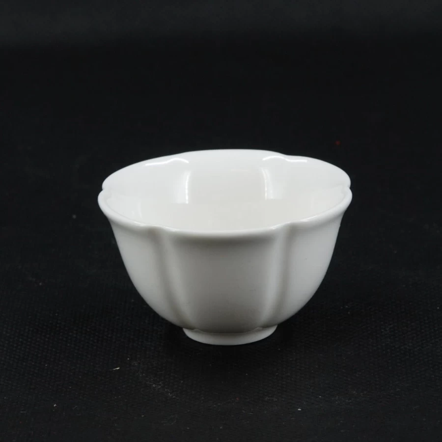 "Elegant White Porcelain Flower-Shaped Tea Cup by The Chinese Tea Shop – Handcrafted Floral Design"