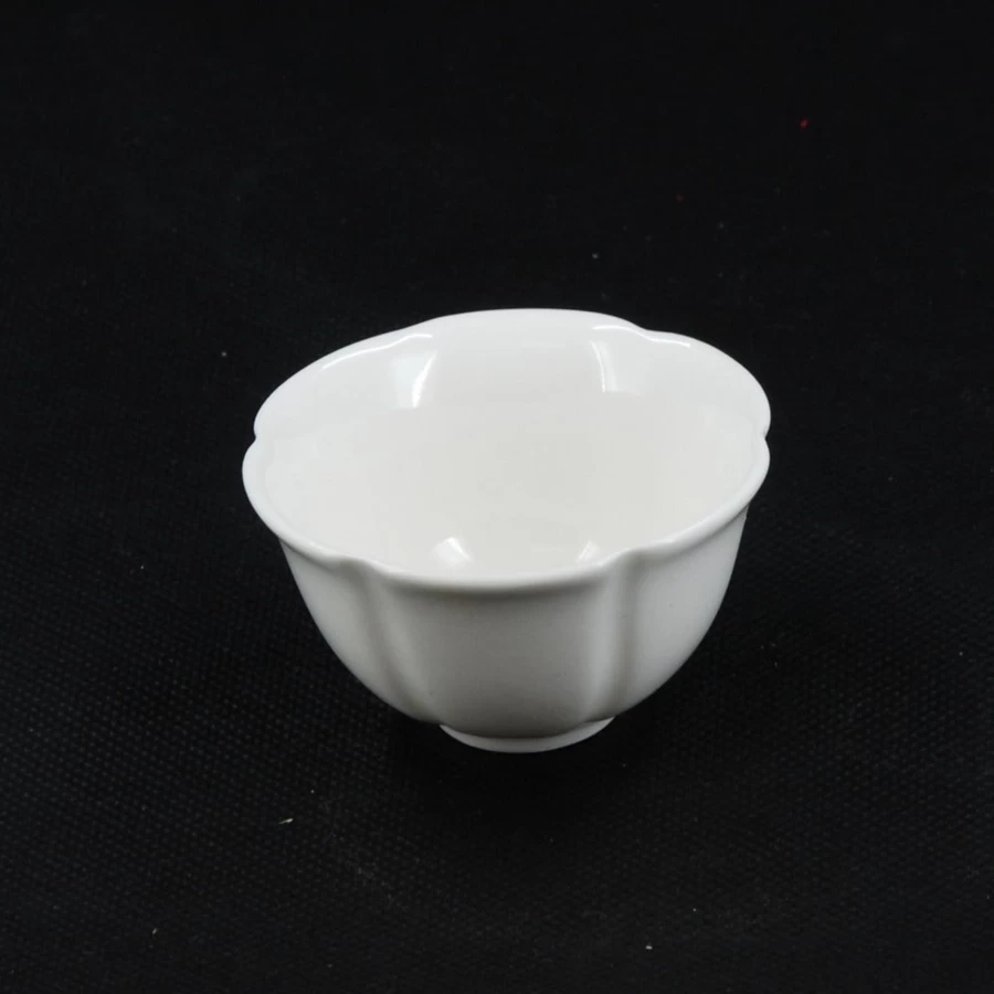 "Elegant White Porcelain Flower-Shaped Tea Cup by The Chinese Tea Shop – Handcrafted Floral Design"